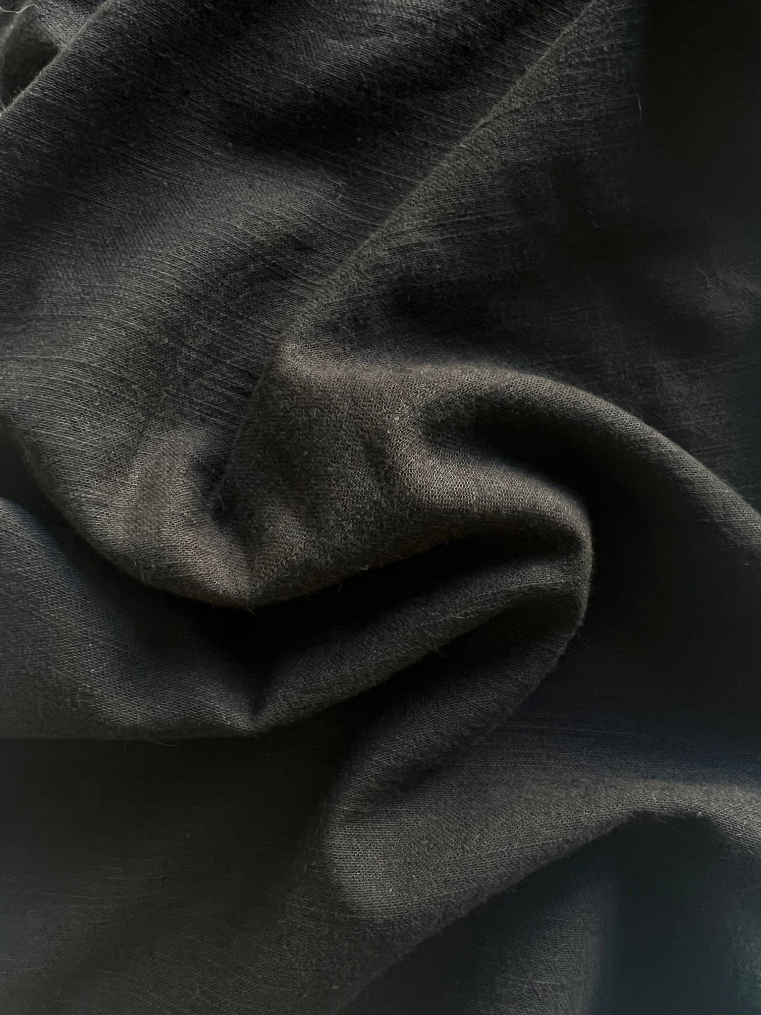 A close up image of a Handcrafted Everyday Top - Black Cotton.