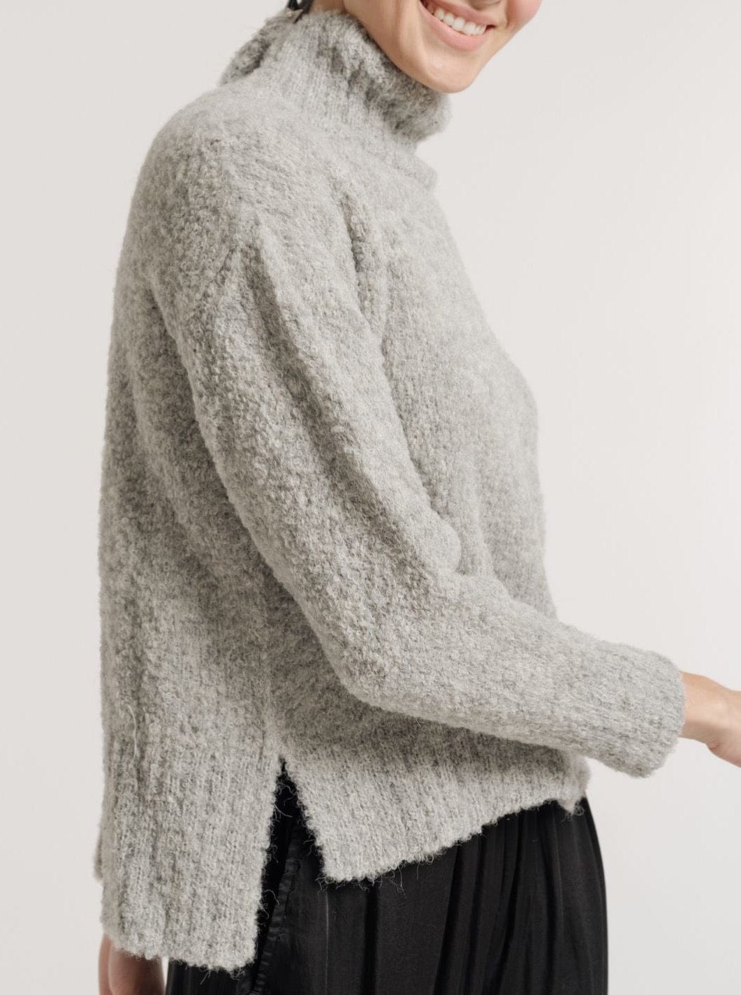 The model is wearing a Totto Sweater - Ghost Grey.