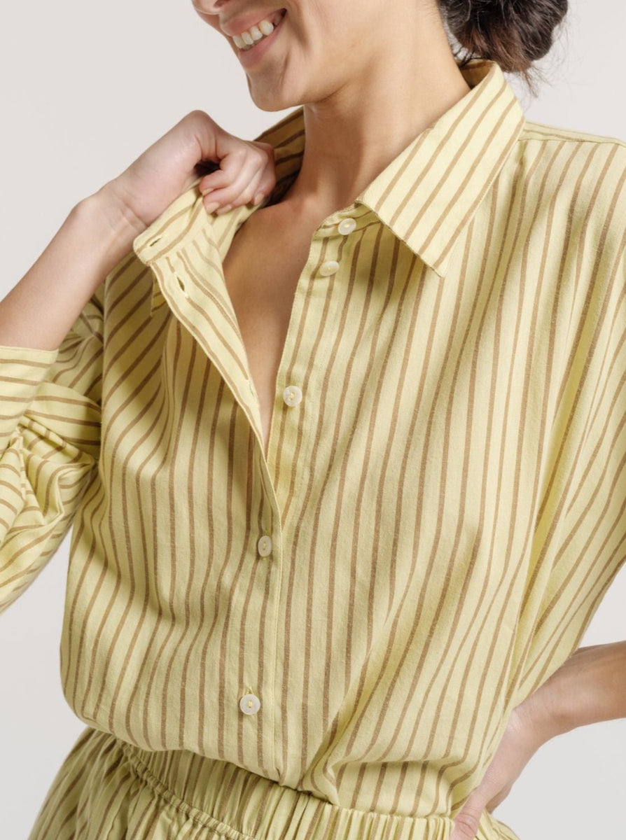 The model is wearing a Museo Button Up - Feather Grass Stripe.