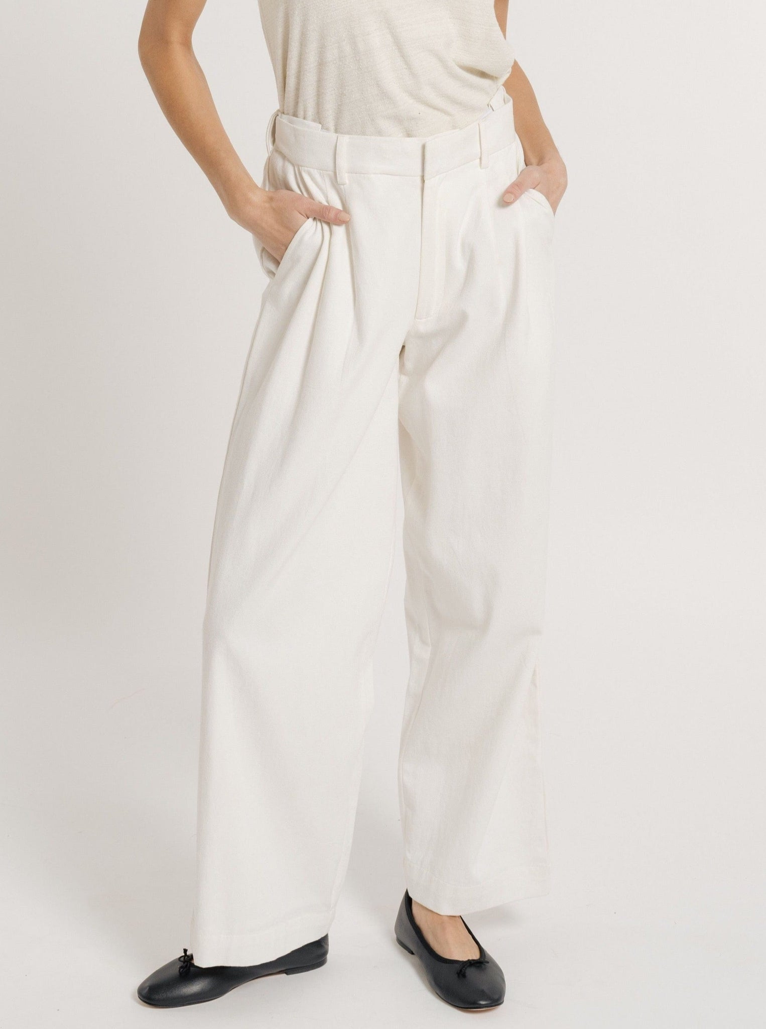 The model is wearing an Alfred Trouser - Ivory.