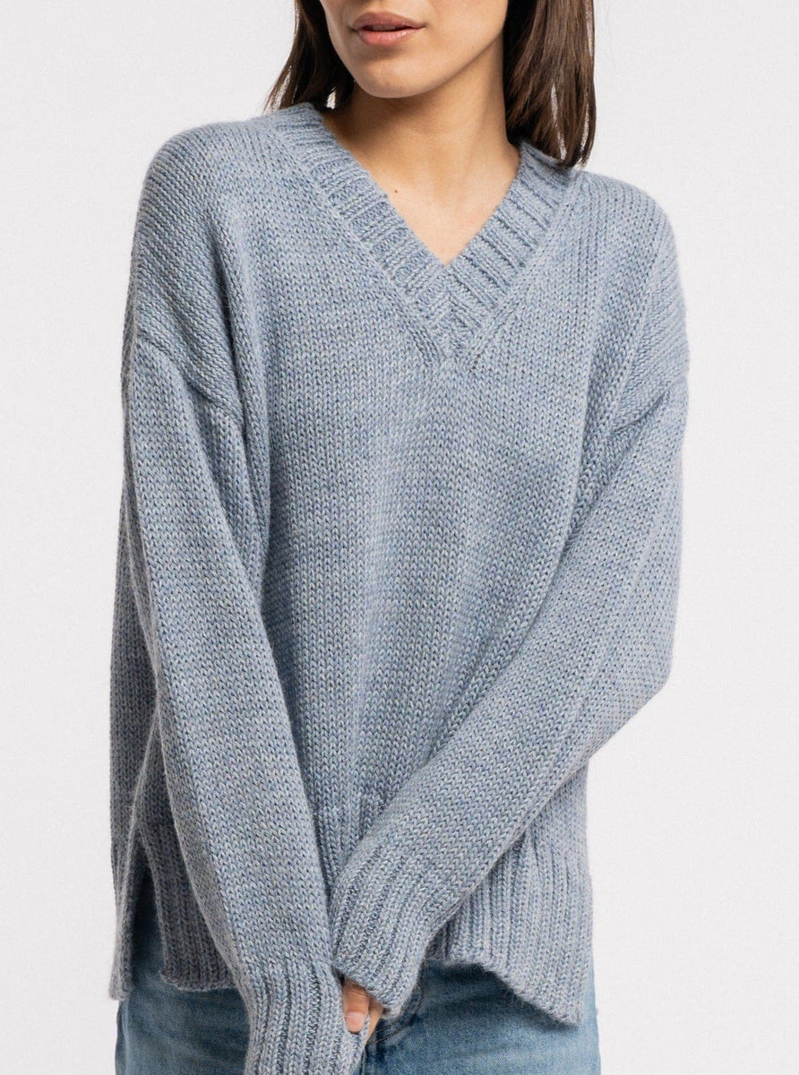 The handmade Billy Sweater - Dusty Blue with ribbed trims in light blue.