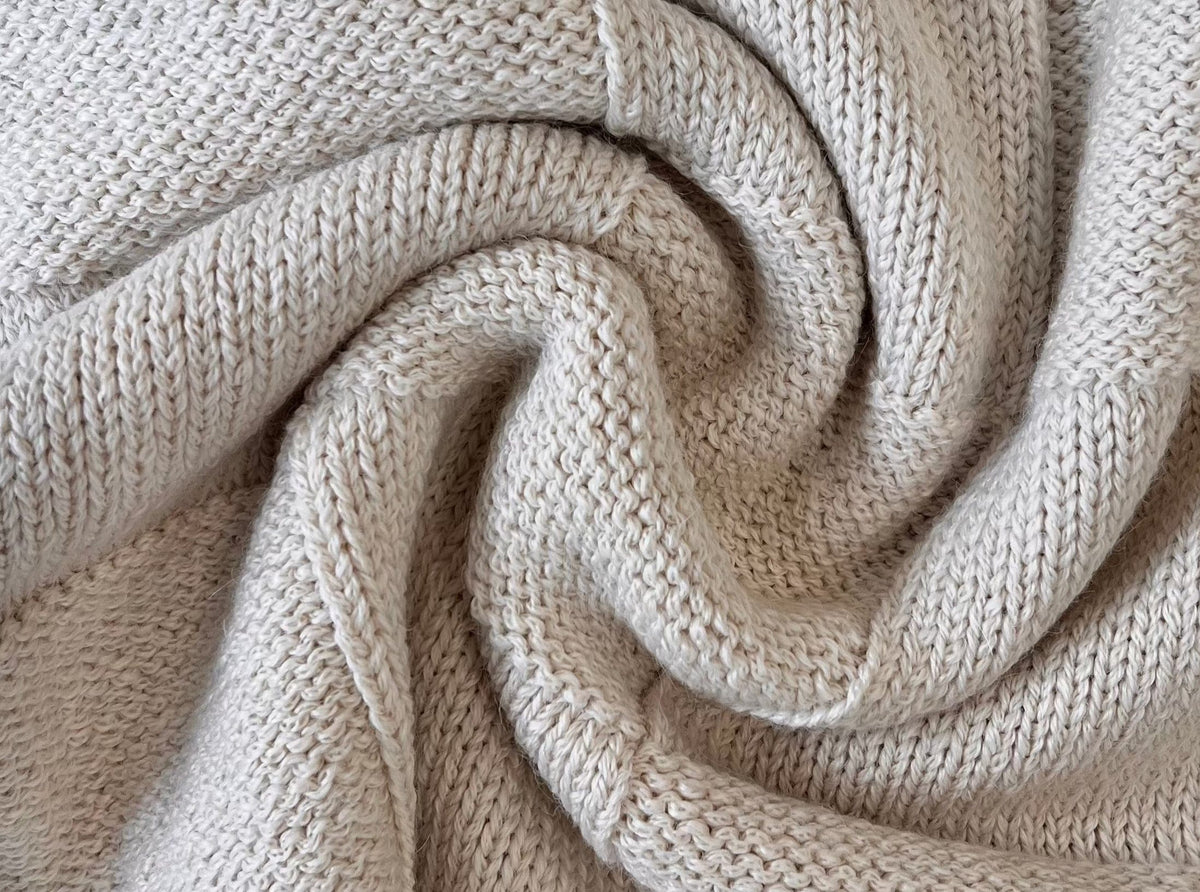 A close up of a Heritage Basketweave Sweater - Ivory.