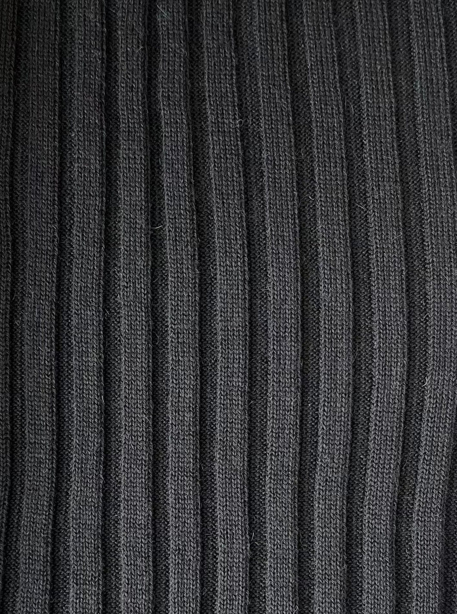 A close up of a Soa Ribbed Turtleneck - Black.