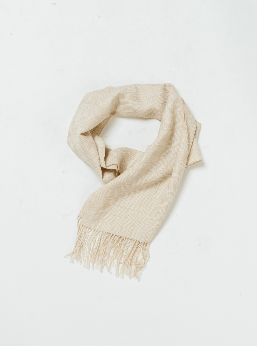 A versatile Woven Fringed Scarf - Oat, lightweight on a white background.