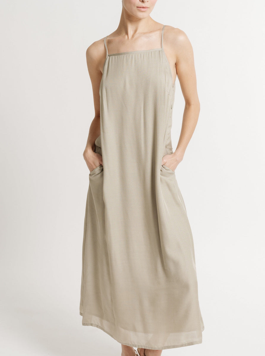 The model is wearing a 90's Maxi Slip Dress - Putty - Pre-order with straps made of Bemberg Cupro Crepe.