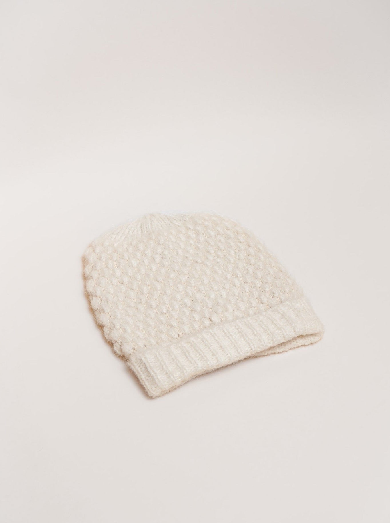 A Heritage Bauble Beanie - Ivory from Peru, showcased on a plain white background.