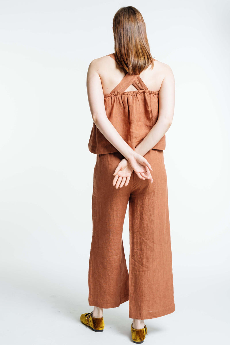 The back of a woman wearing an Everyday Crop - Amber Brown jumpsuit.