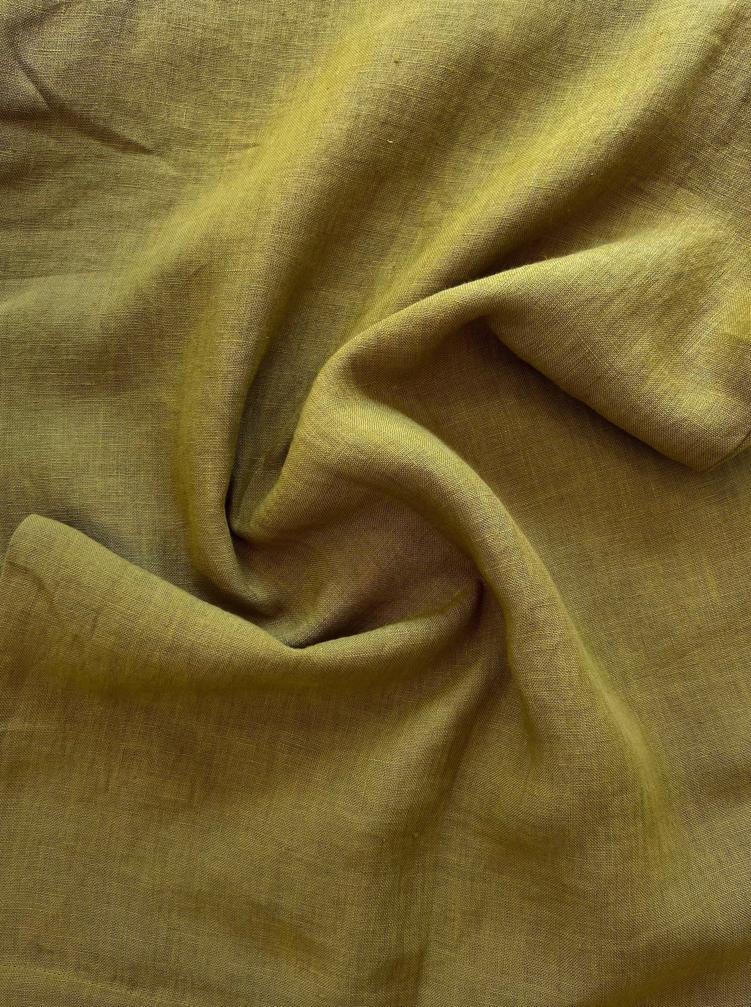 A close up image of Everyday Short - Dried Tobacco in a yellow linen fabric.