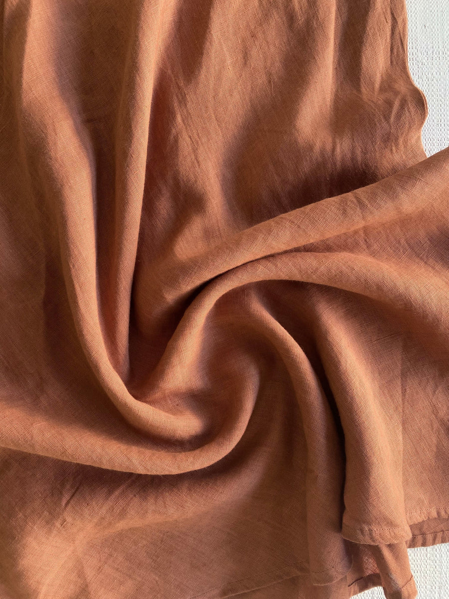 A close up of a Breeze Tank - Amber Brown linen fabric.