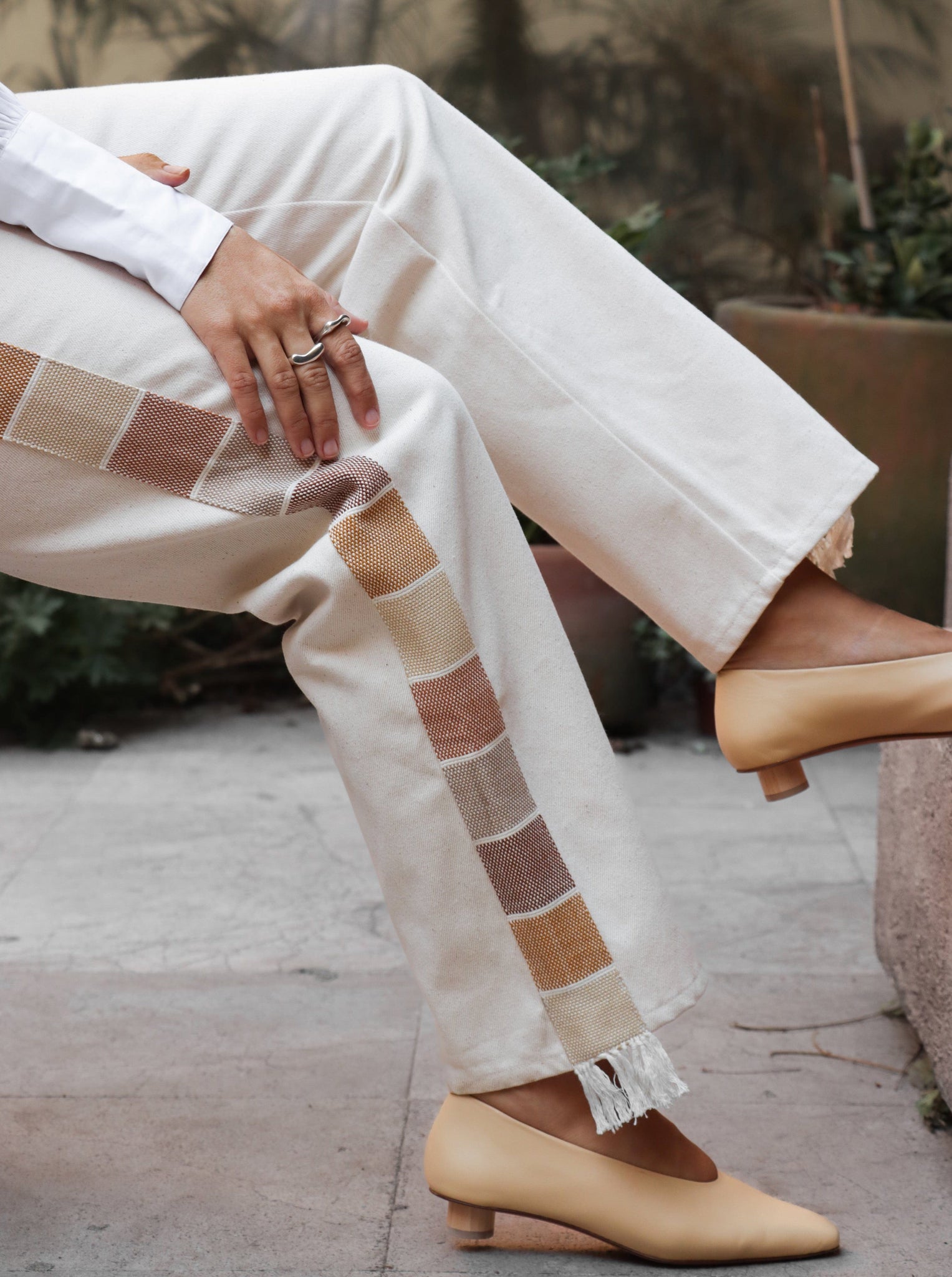 A woman wearing Painter Pant - Baked Earth Ombre and tan shoes.