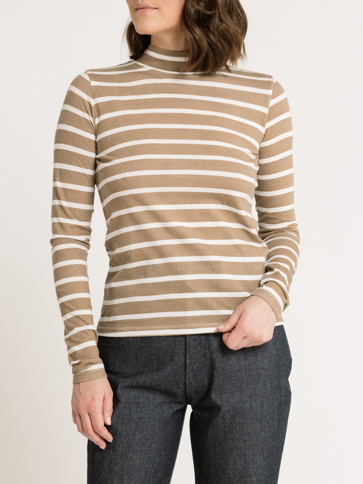 A woman wearing Sample 144 - Mock Neck Long Sleeve Tee - Tannin Stripe as a fit sample.