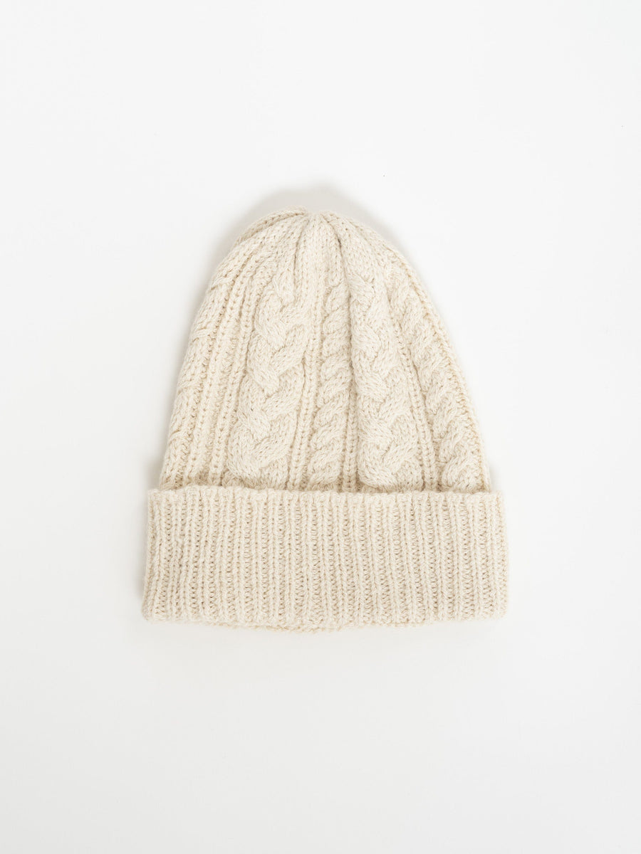 Heritage Cable Beanie - Cream on a white background.