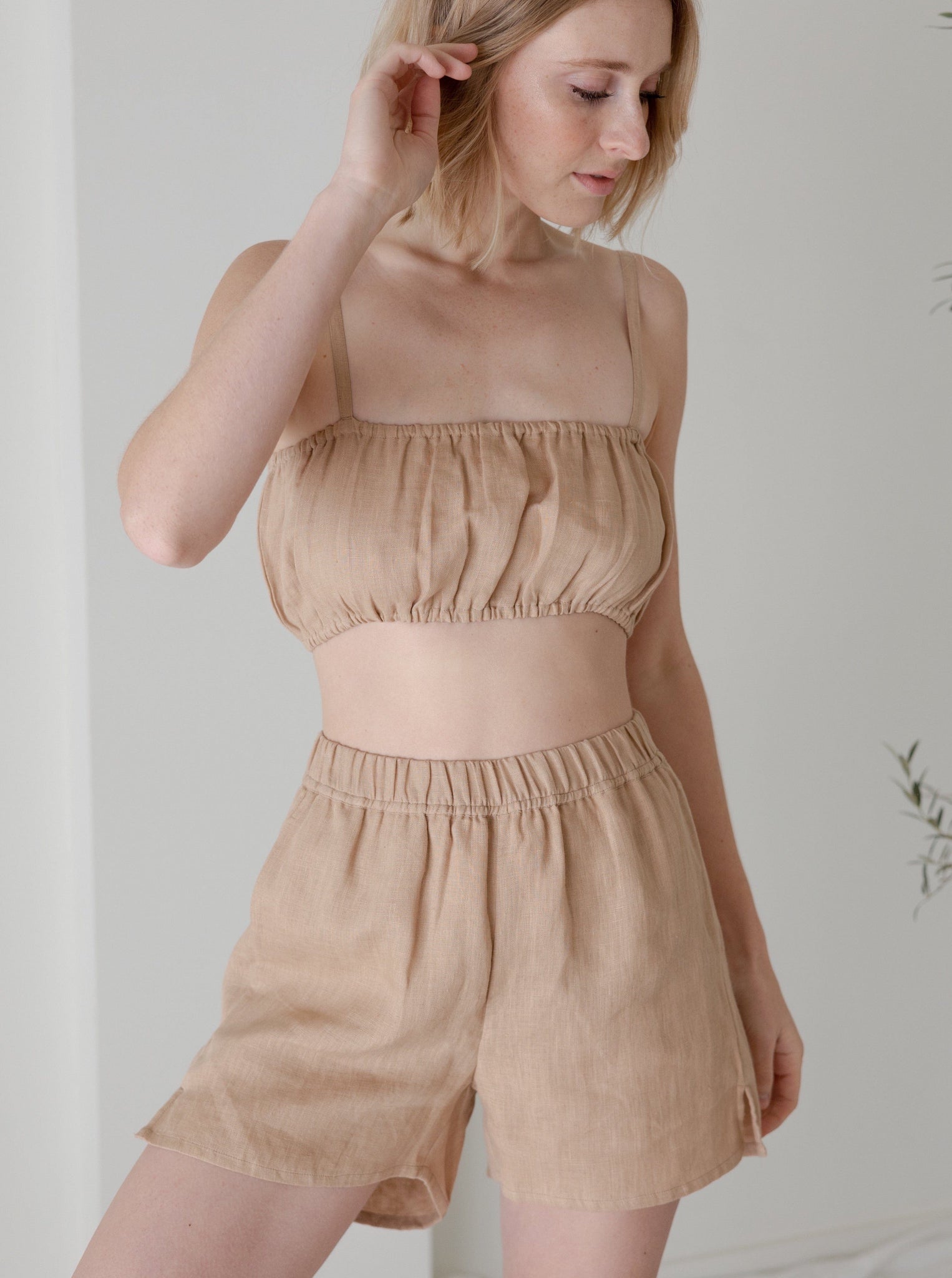 The model is wearing a Elastic Bandeau - Ginger - Sample.