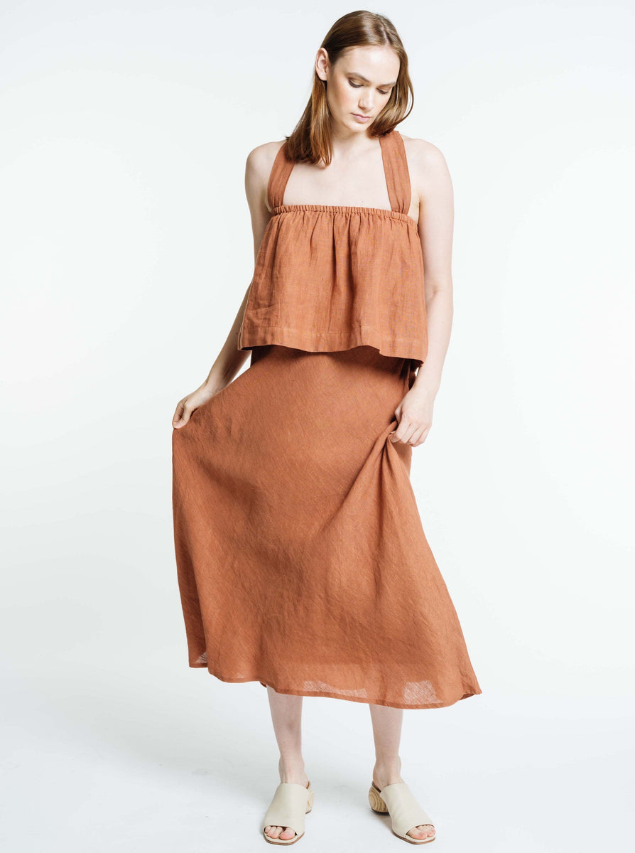 The model is wearing a handmade Breeze Tank - Amber Brown colored linen dress.