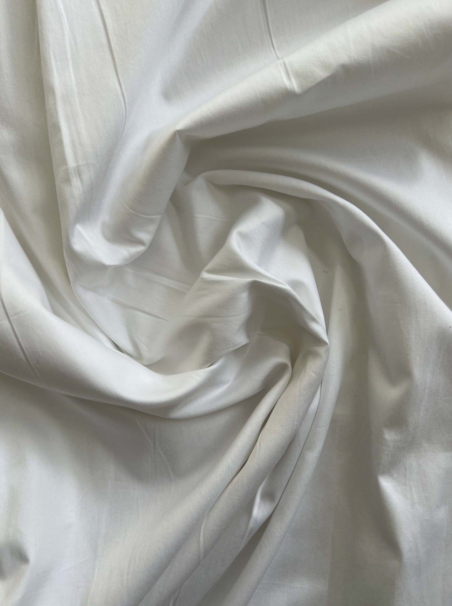 A close up of a Dolores Dress - White fabric.